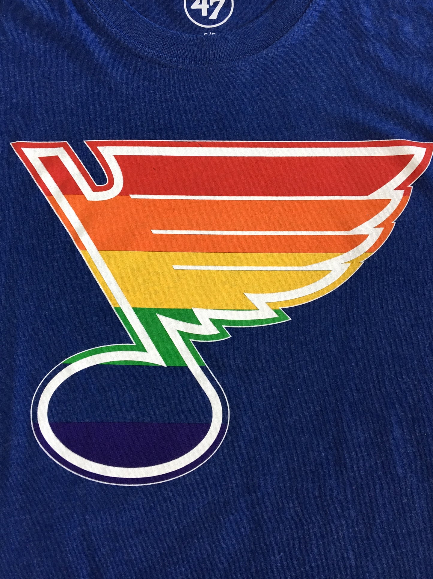 Blues note with rainbow pride flag detail