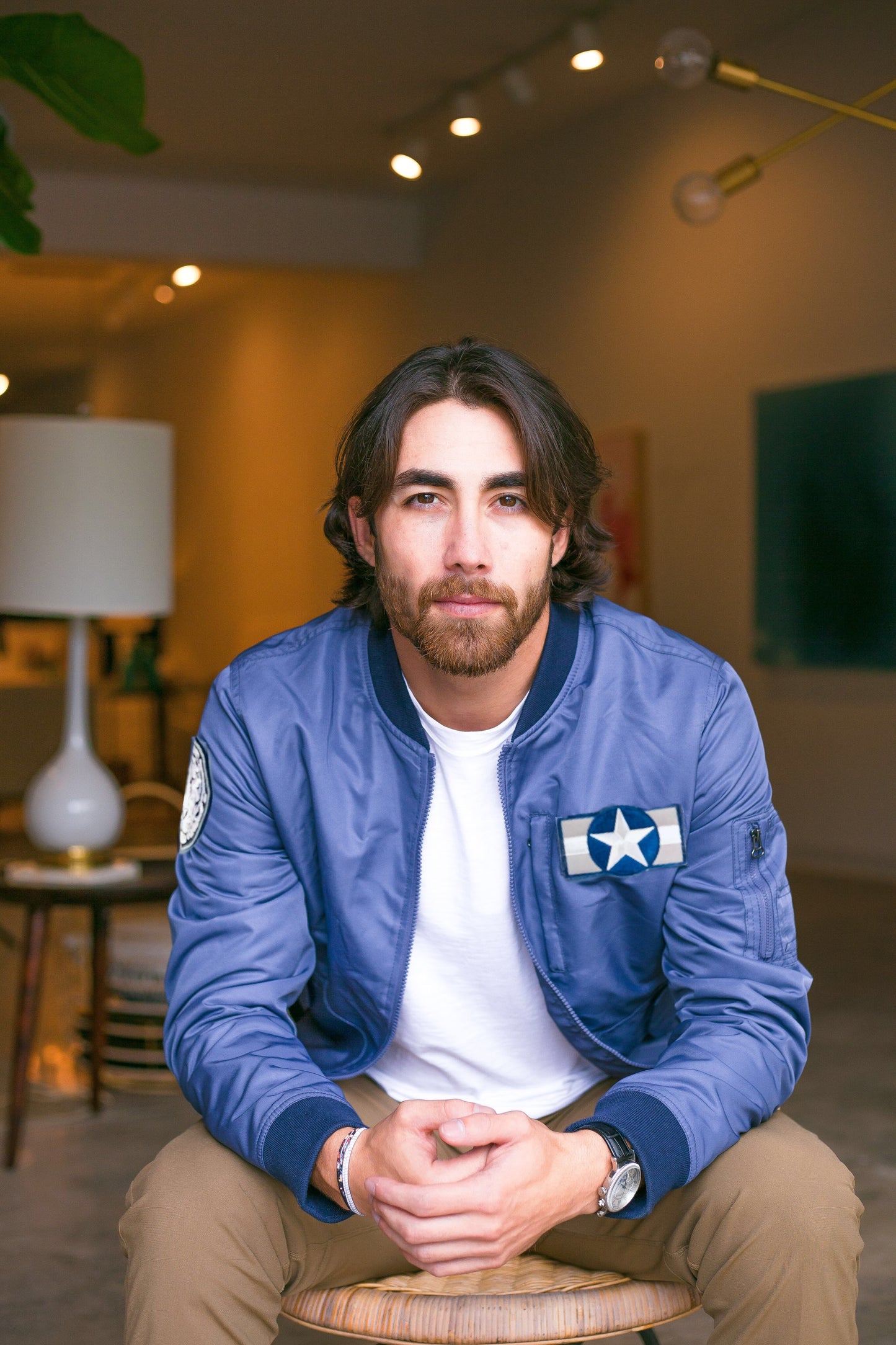 Model wearing Bitching Betty Bomber Men's Jacket in Blue